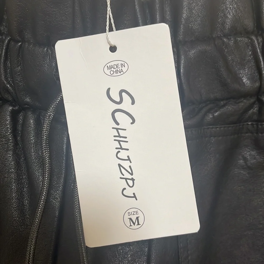 SCHHJZPJ size Medium pleather shorts. Black. Pockets. New!